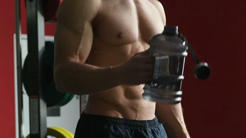 Bodybuilder athletic man workout muscles exercise in gym Video stock 127545336