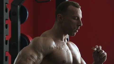Bodybuilder athletic man workout muscles exercise Video stock 127872516
