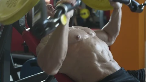 Bodybuilder athletic man workout muscles exercise Видео 127872899