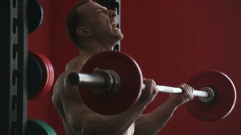 Bodybuilder athletic man workout muscles exercise Video stock 127873009