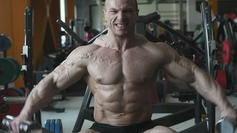 Bodybuilder athletic man workout muscles exercise Video stock 127873064