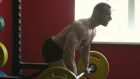 Bodybuilder athletic man workout muscles exercise Video stock 127873132