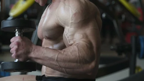 Bodybuilder athletic man workout muscles exercise Video stock 127873256