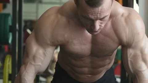 Bodybuilder athletic man workout muscles exercise Video stock 127873371