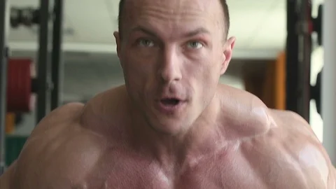 Bodybuilder athletic man workout muscles exercise Video stock 127873488