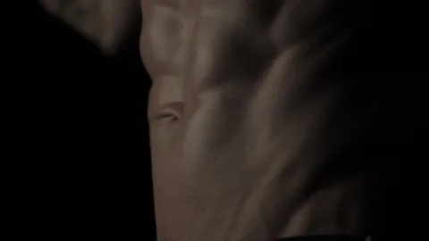 Bodybuilder on black background Video stock 128345635