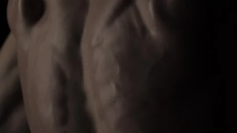 Bodybuilder on black background Video stock 128345675