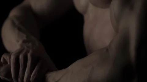 Bodybuilder on black background Video stock 128345681