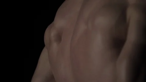 Bodybuilder on black background Video stock 128345878