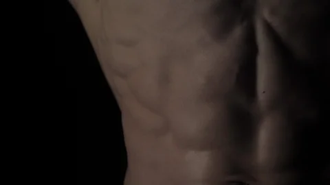 Bodybuilder on black background Video stock 128345883