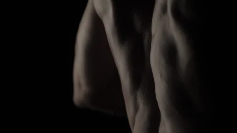 Bodybuilder on black background Stock Footage 128346851
