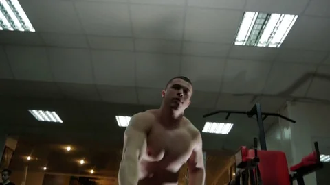 Bodybuilder deals with weights Stock Footage 75807779