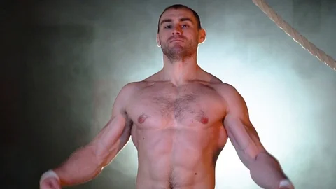 The bodybuilder demonstrates his muscles Stock Footage 86082549