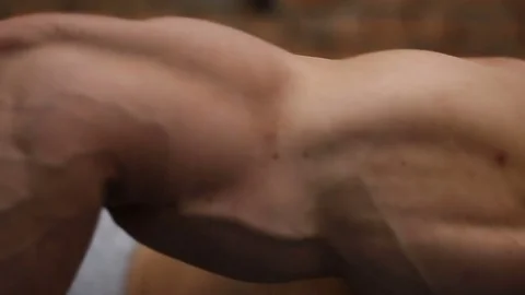 Bodybuilder does push-ups in the fitness club Stock Footage 76969681