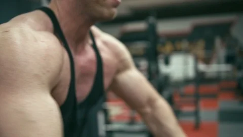 Bodybuilder doing cable crossover fly Stock Footage 90308738