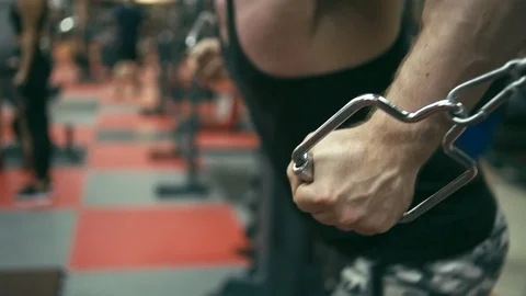 Bodybuilder doing cable crossover fly Stock Footage 90308777