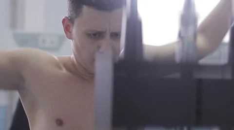 Bodybuilder doing exercise on the back Stock Footage 57297562