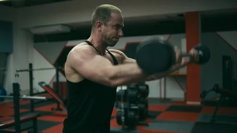 Bodybuilder doing Front Barbell Raise Stock Footage 90309504