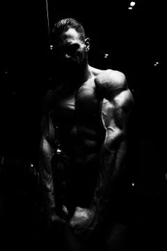 Bodybuilder Doing Heavy Exercise For Triceps With Cable Stock Photos