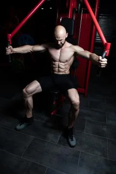 Bodybuilder Doing Heavy Weight Exercise For Chest Stock Photos