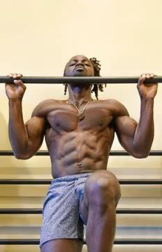Bodybuilder Doing Pull-Ups in the Gym Stock Photos