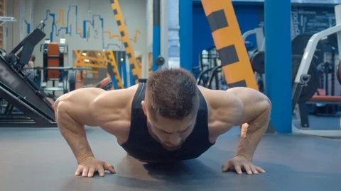 Bodybuilder doing push up Stock Footage 112530837