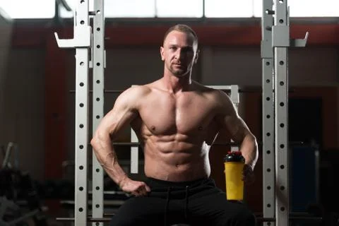 Bodybuilder Drinking Water From Shaker Stock Photos