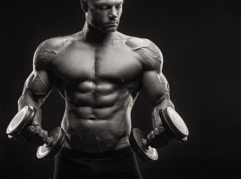 Bodybuilder with dumbbell Stock Photos