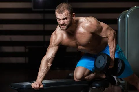 Bodybuilder with dumbbell Stock Photos