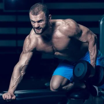 Bodybuilder with dumbbell Stock Photos