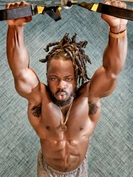 Bodybuilder Exercising in the Gym Stock Photos