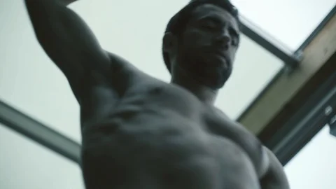 Bodybuilder exercising with a kettlebell at the gym Stock Footage 127435794