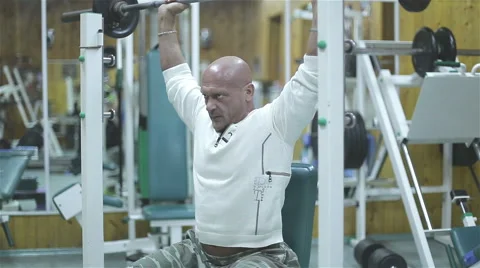 Bodybuilder exercising pectoral at gym Stock Footage 56466110