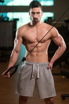 Bodybuilder Exercising Triceps Stock Photos