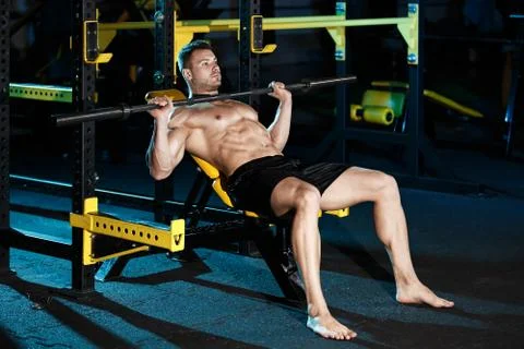 Bodybuilder exercising with weights Stock Photos