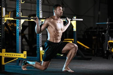 Bodybuilder exercising with weights Stock Photos