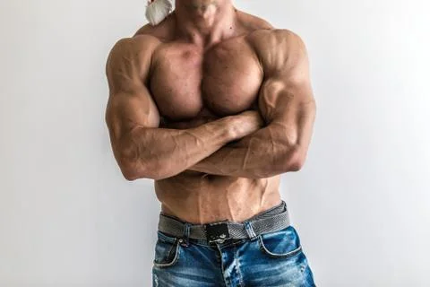 Bodybuilder flexing his muscles in studio. The torso of attractive male body  Foto stock