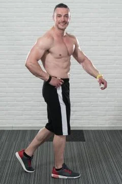 Bodybuilder Flexing Muscles Stock Photos