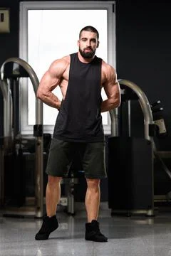 Bodybuilder Flexing Muscles Stock Photos