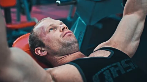 Bodybuilder guy in gym Stock Footage 87701678