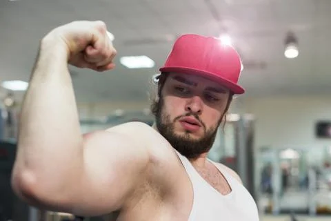 A bodybuilder guy in gym 写真素材