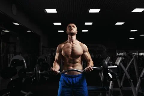 Bodybuilder in the gym Stock Photos