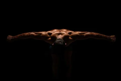 The bodybuilder has spread both arms and snapped a photo from above 스톡 사진