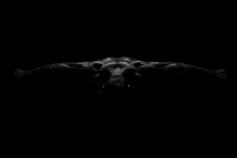 The bodybuilder has spread both arms and snapped a photo from above Stock Photos