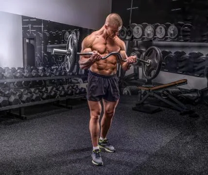Bodybuilder lifting barbell Stock Photos