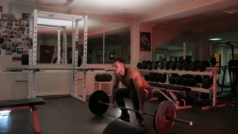Bodybuilder lifts the barbell Stock-Footage 75807642