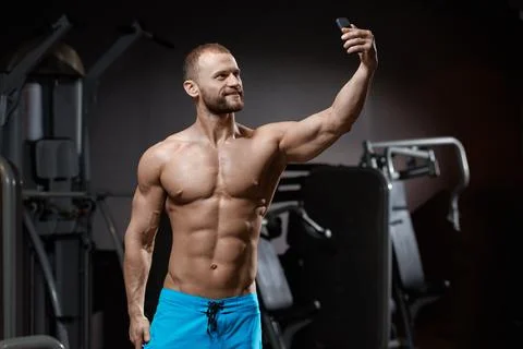 Bodybuilder making selfie Stock Photos