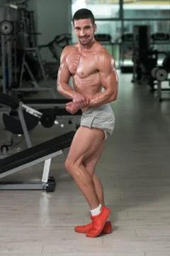 Bodybuilder Man Posing In The Gym Stock Photos