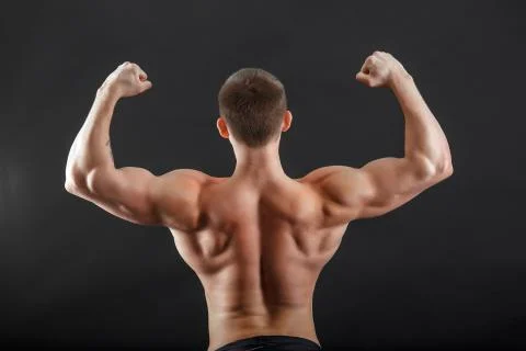 A bodybuilder man posing turn his back Stock Photos