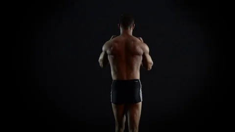 Bodybuilder Man Show His Torso Muscles 4K Video Stock Footage 73095030